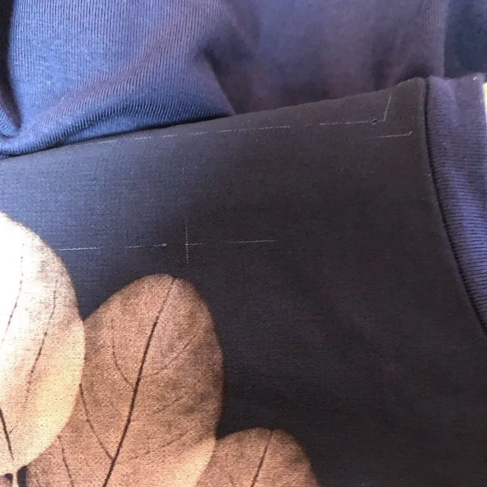 Guess tunic top, small snag line at the top